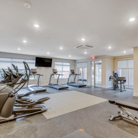 Well equipped modern fitness center at Fox Plan Apartments in Monroeville, Pennsylvania