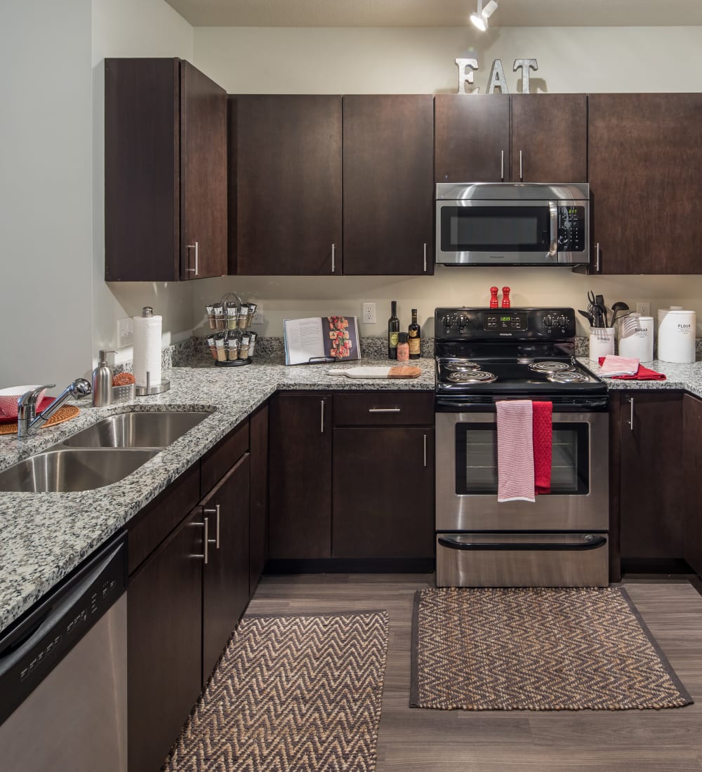 Gourmet kitchen with stainless-steel appliances at The Foundry in Ames, Iowa
