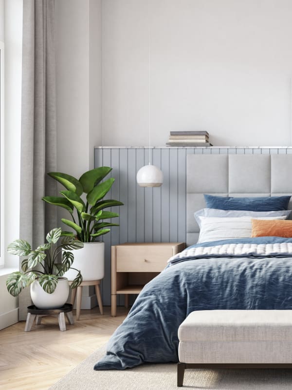 Modern and bright bedroom with plants at The Mallory in Raleigh, North Carolina
