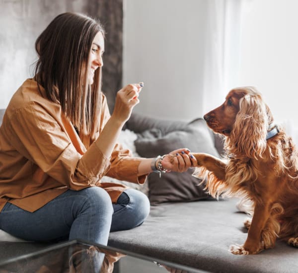 Resident and her dog in their home at Integra Village at Tymber Creek in Daytona Beach, Florida