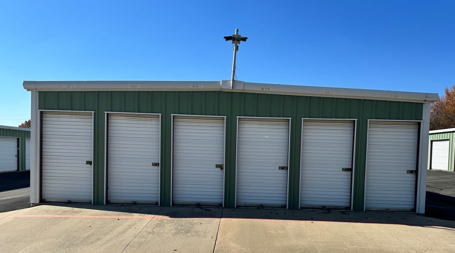 A family carrying storage boxes into their new home near KO Storage in Springfield, Missouri