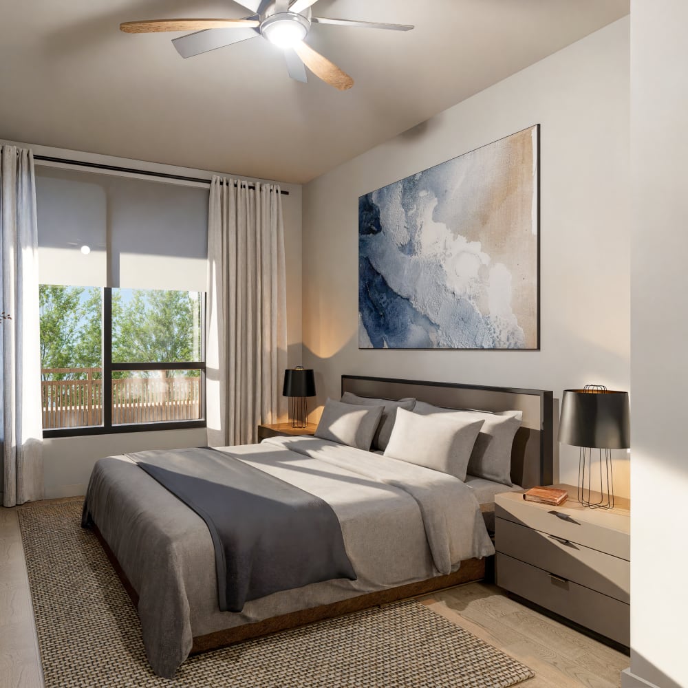 Cozy bedroom with large windows and modern decor at Bellwood Gateway Apartments in Bellwood, Illinois