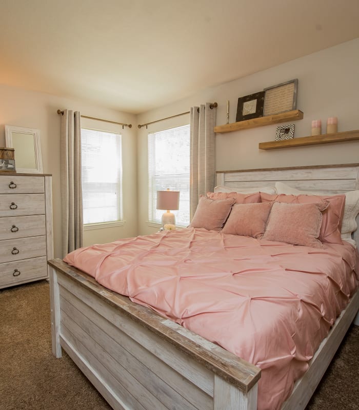 Spacious carpeted bedroom at The Remington Apartments in Wichita, Kansas