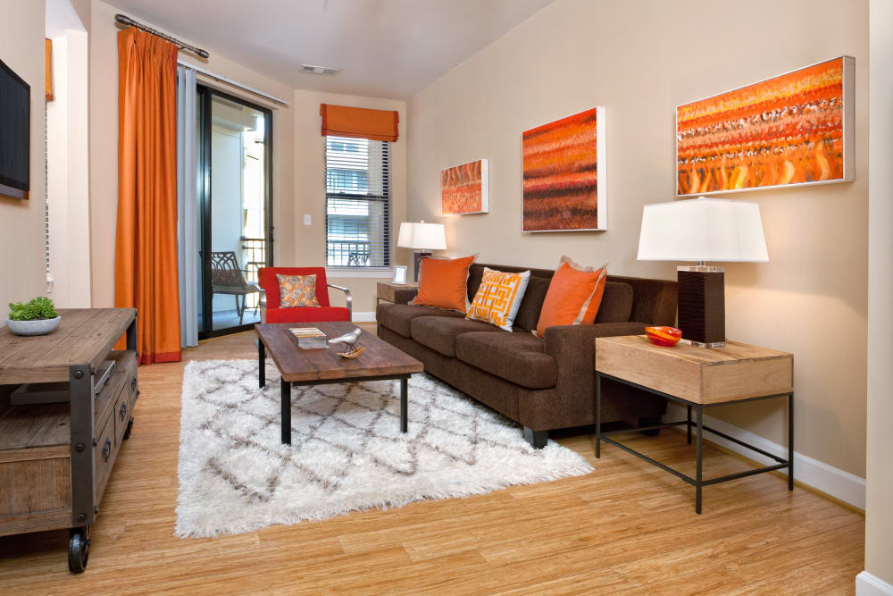 Spacious model living room opening onto a private balcony at Cielo in Charlotte, North Carolina