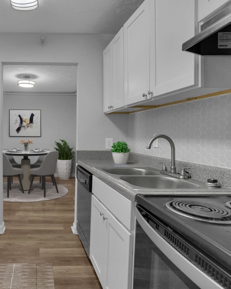 Upgraded appliances and light wood cabinets in a kitchen at Silver Creek Crossing in Austell, Georgia