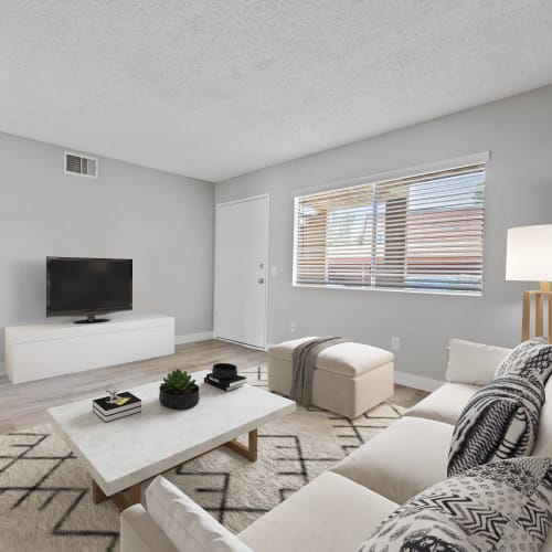 Wood-style flooring in an apartment living room at Ardella at Reche Canyon in Colton, California