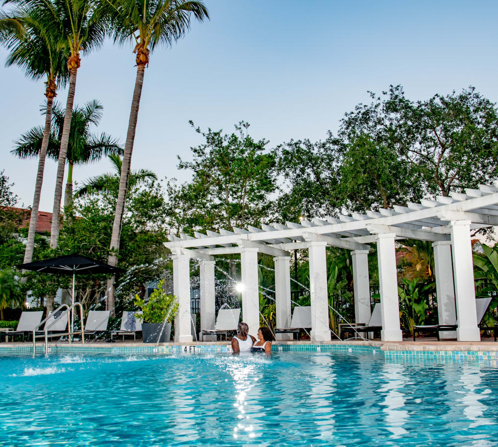 Residents enjoying one of the luxury swimming pools at The Sophia at Abacoa in Jupiter, Florida