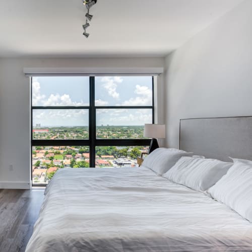 Bright window in an apartment bedroom at MB Station in Miami, Florida