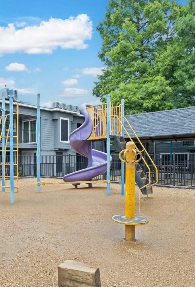 Slide for kids in a community playground at Lila Apartments in Dallas, Texas