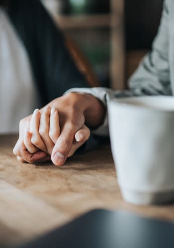 Two residents holding hands at The Joyce in Durham, North Carolina