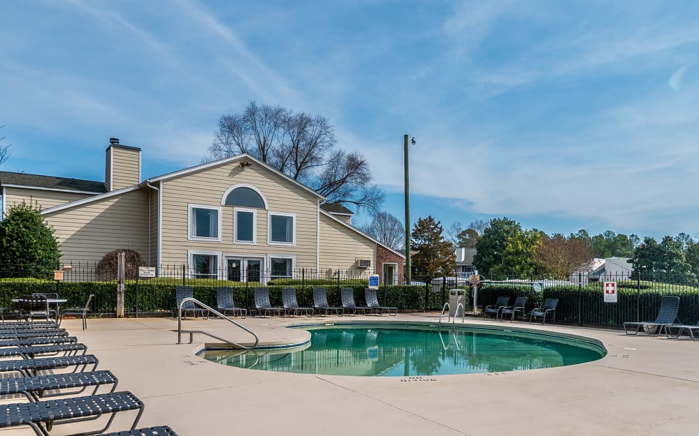 Resident mother and daughter playing in the swimming pool at Summerlin at Concord Apartment Homes in Concord, North Carolina