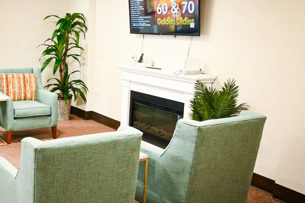 Cozy living room area and fireplace at English Meadows Crozet Campus in Crozet, Virginia