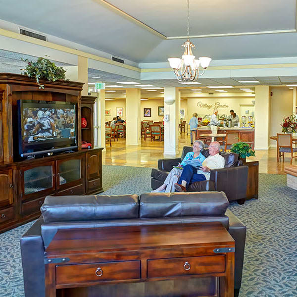 Residents relaxing and watching TV at Monte Vista Village in Lemon Grove, California