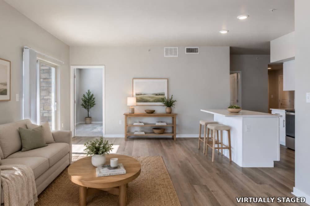 Room with natural light with access to the kitchen at The Greens at Van de Water in Loveland, Colorado  