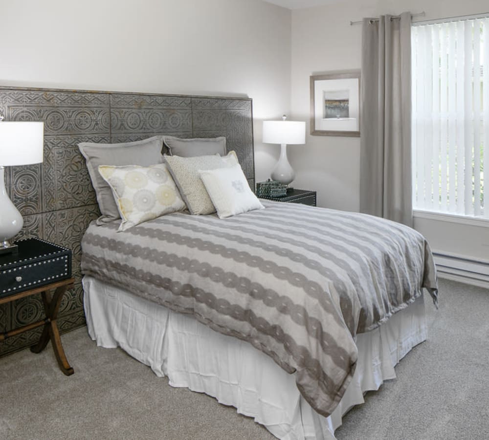 Spacious master bedroom with plush carpeting at Center Pointe Apartment Homes in Beaverton, Oregon