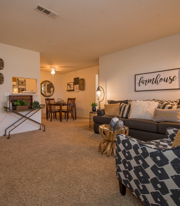 Carpeted living room at Waters Edge in Oklahoma City, Oklahoma