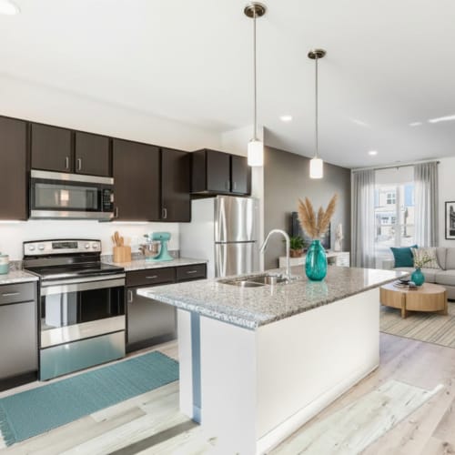 Kitchen with island and hanging light at Union Court Senior Apartments and Townhomes in Kenosha, Wisconsin
