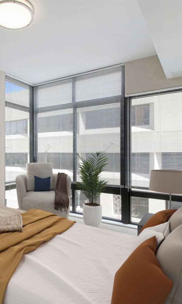 Bedroom with large windows at Residences on The Lane in Rockville, Maryland