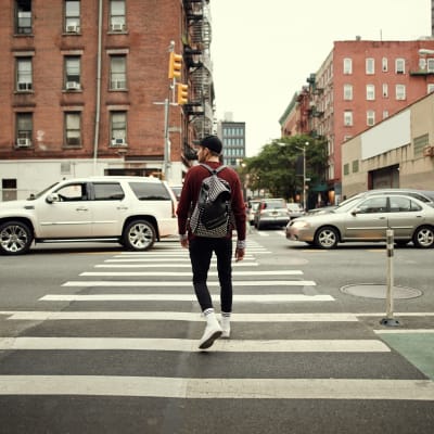 Resident crossing the street near Barcalo Living in Buffalo, New York