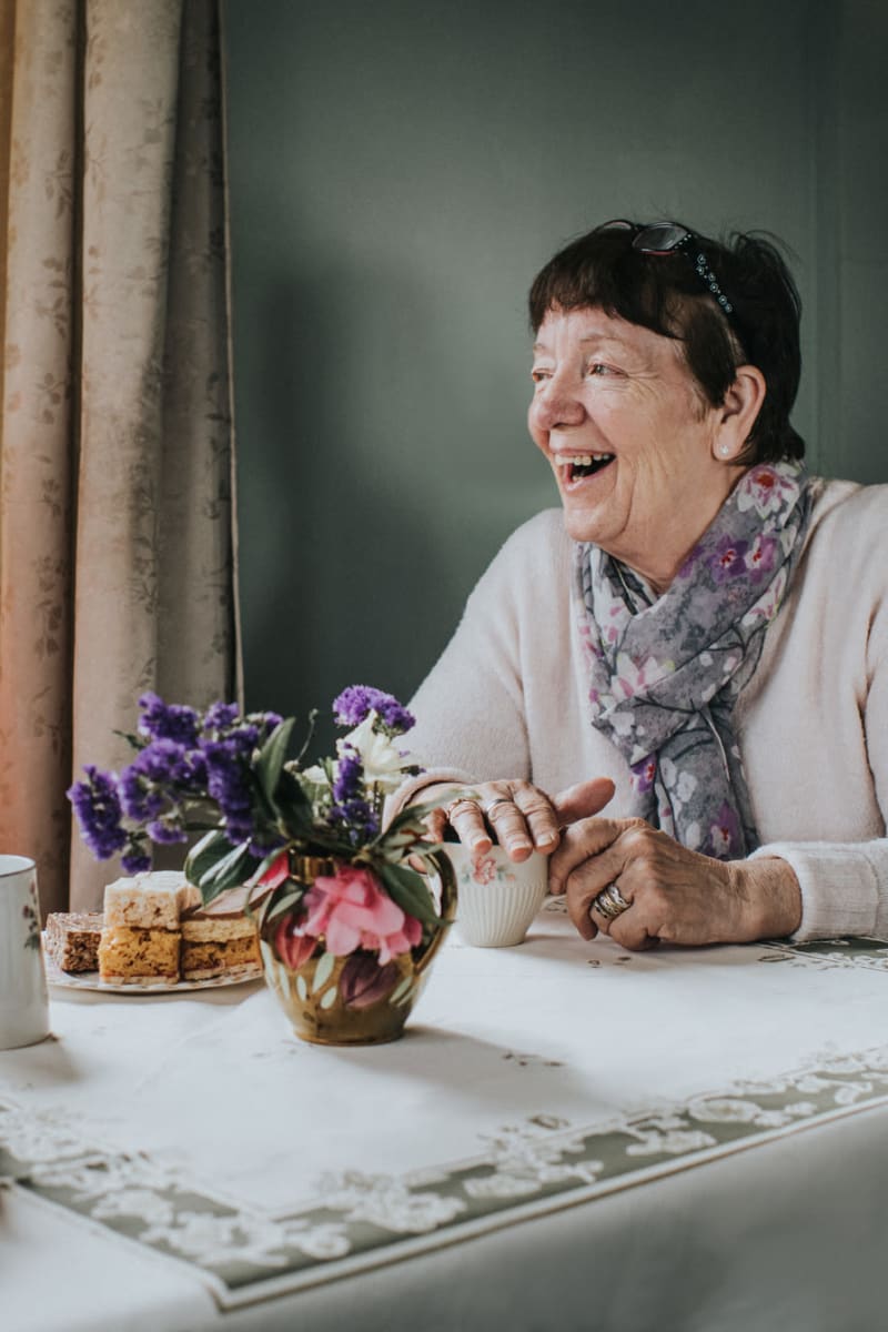 Resident enjoying freshly baked goods at East Troy Manor in East Troy, Wisconsin