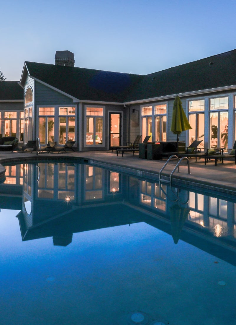 Swimming pool at sunset overlooking units at Marquis Castle Pines in Castle Pines, Colorado