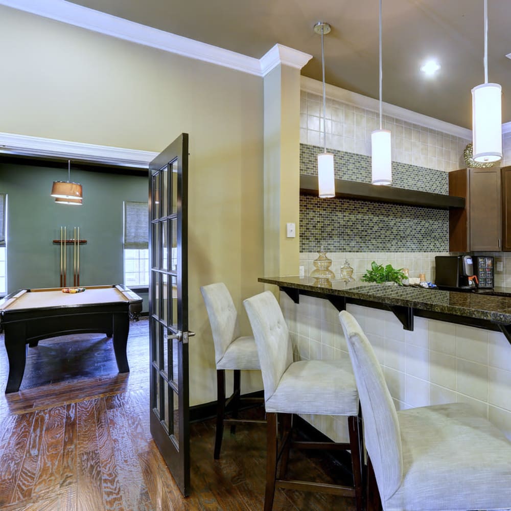 Kitchen with a bar next to a pool table at Deerfield at Providence in Mt. Juliet, Tennessee