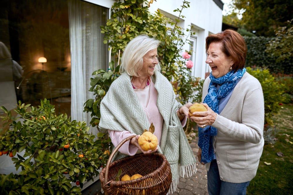 Residents smiling at Creekside Village Senior Apartment Homes in Pittsburg, California