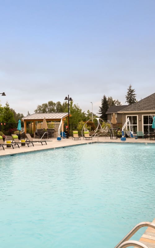 Sparkling Pool View with Lounge Chairs at Terrene at the Grove in Wilsonville