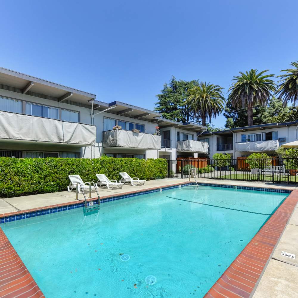 Stunning community swimming pool with shimmering water at Glenwood Garden Apartments in Mountain View, California