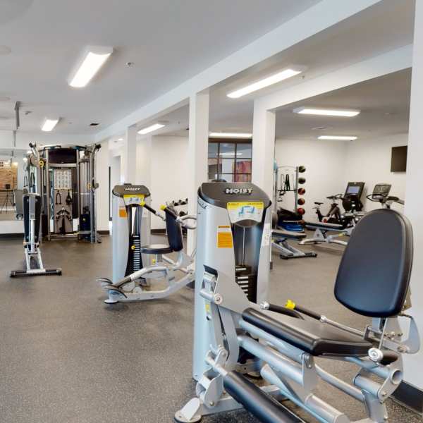 Fitness center with weight machines at The Quarters at Oxford in Oxford, Mississippi