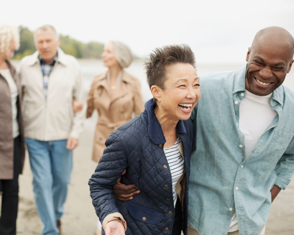 Group of seniors walking by the water near Anthology of Tanglewood in Houston, Texas