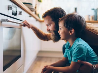 Checking the oven at Sycamore Commons Apartments in Fremont, California