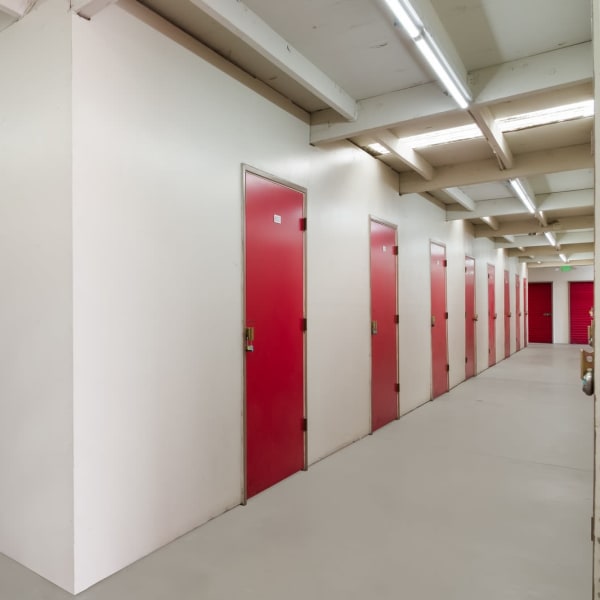 Red doors on indoor units at StorQuest Self Storage in San Leandro, California