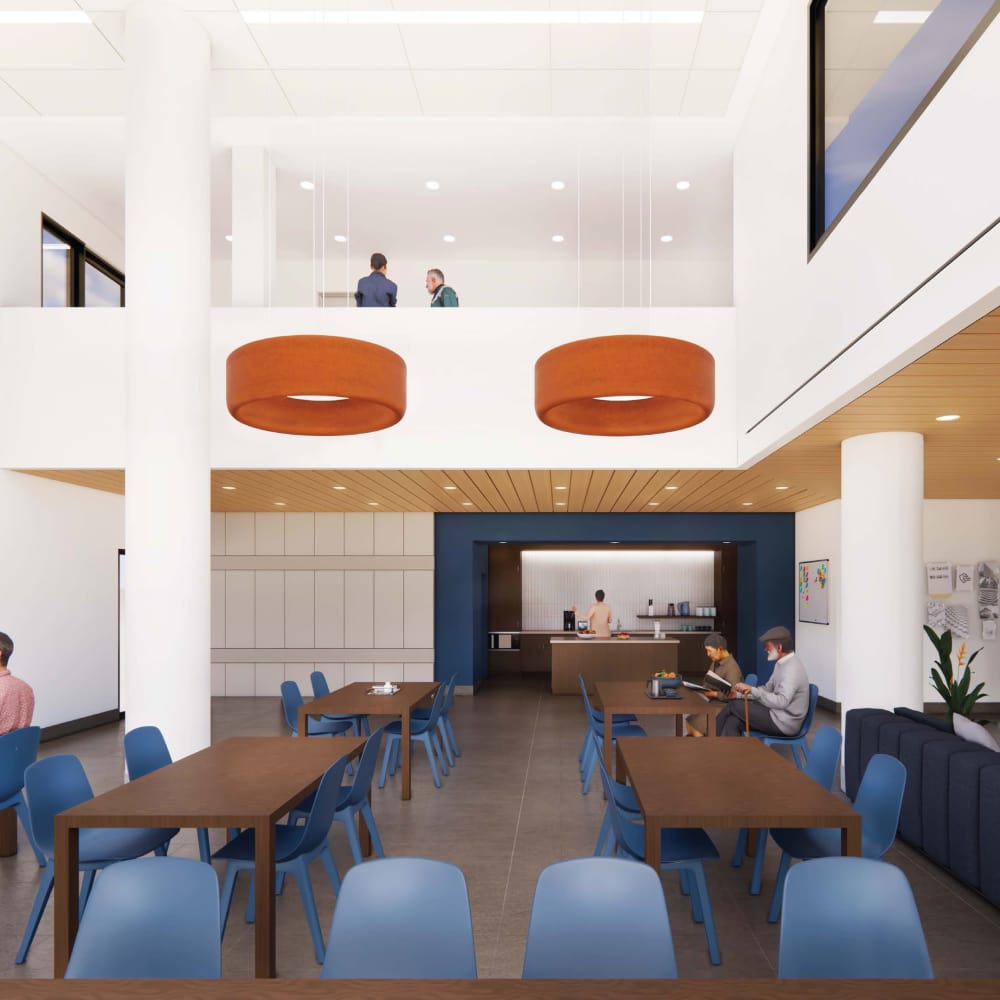 Community seating area with table and chair at 570 Washington in New York, New York