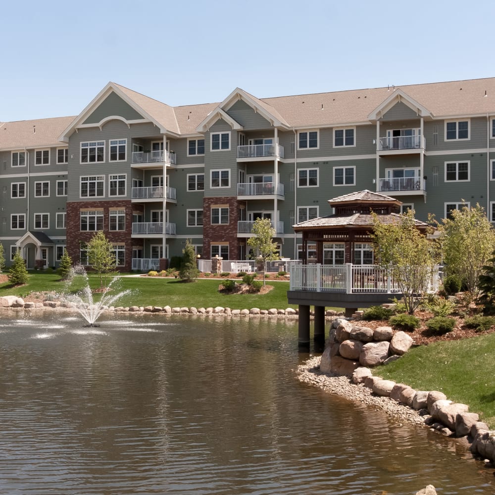 Exterior view with a pond at Applewood Pointe of Bloomington at Southtown in Bloomington, Minnesota. 