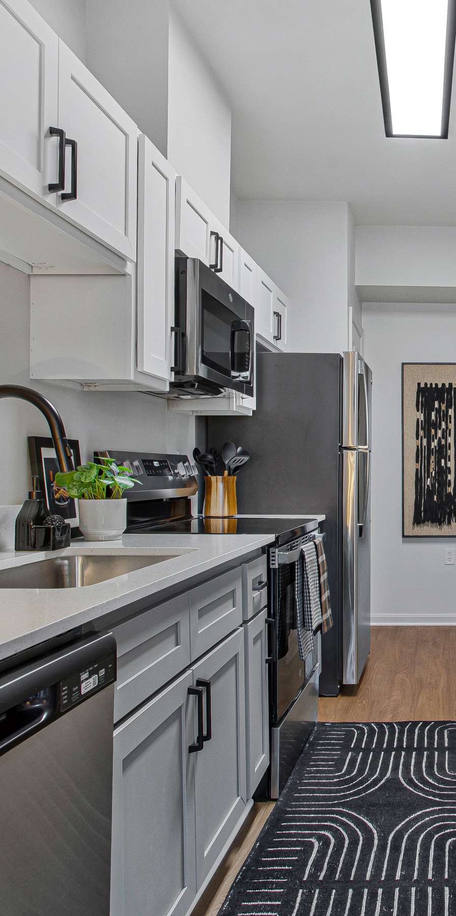 Modern kitchen in a model student apartment at Mazza Grandmarc in College Park, Maryland