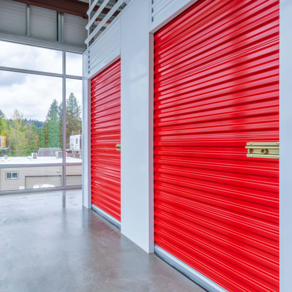 Red doors on indoor units at StorQuest Self Storage in Seattle, Washington
