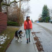 Resident walking with her pet at The Nathaniel in Rochester, New York