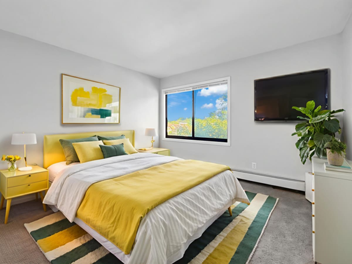 Well lit bedroom Equinox Apartments in Saint Anthony, Minnesota
