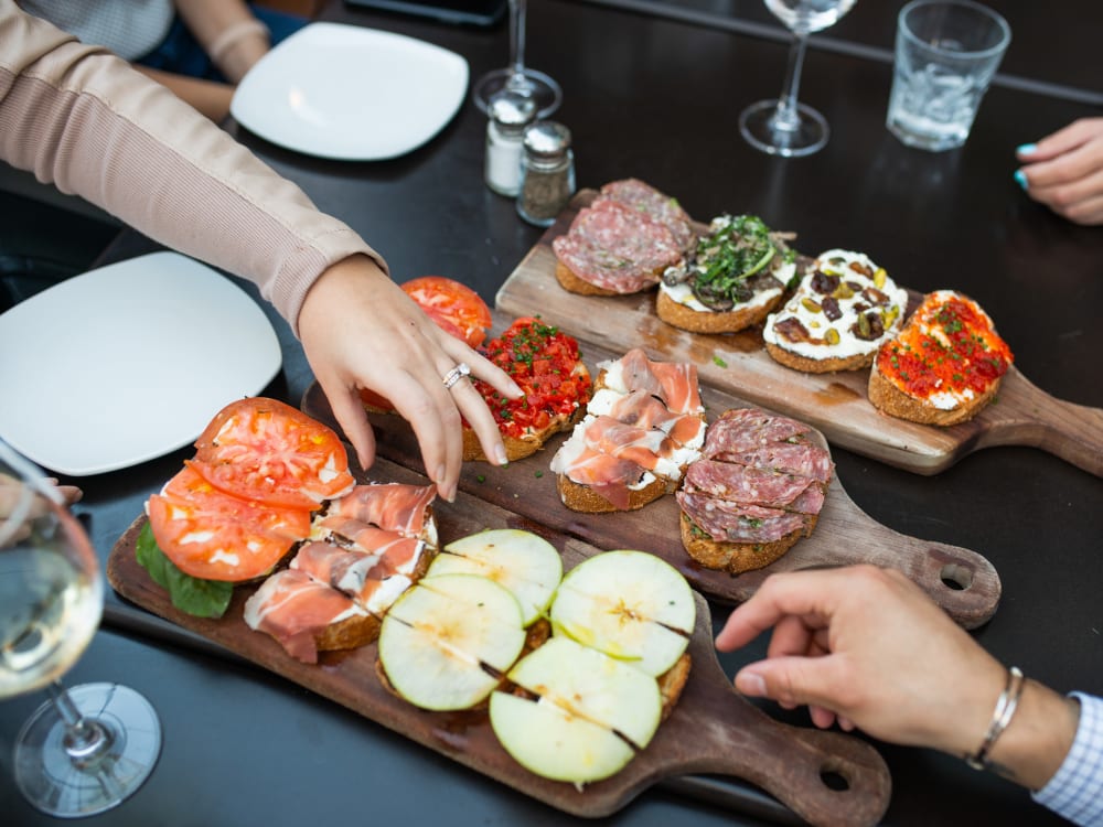 Residents enjoying appetizers at a restaurant near The Regents at Scottsdale in Scottsdale, Arizona