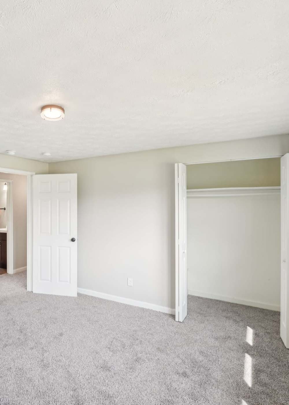 Bedroom with walk-in closet at Columbus Crossing in Columbus, Indiana