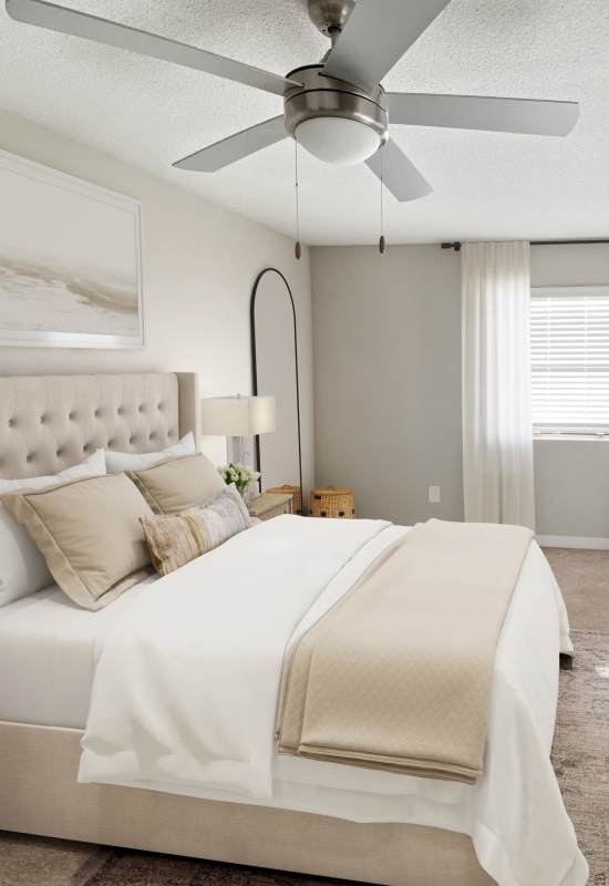 Bedroom with plush carpeting at Aspen Lodge in Overland Park, Kansas