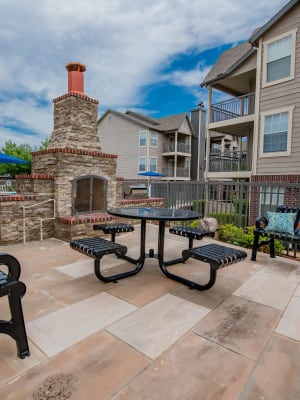 Outdoor seating and fireplace at Crown Pointe Apartments in Oklahoma City, Oklahoma