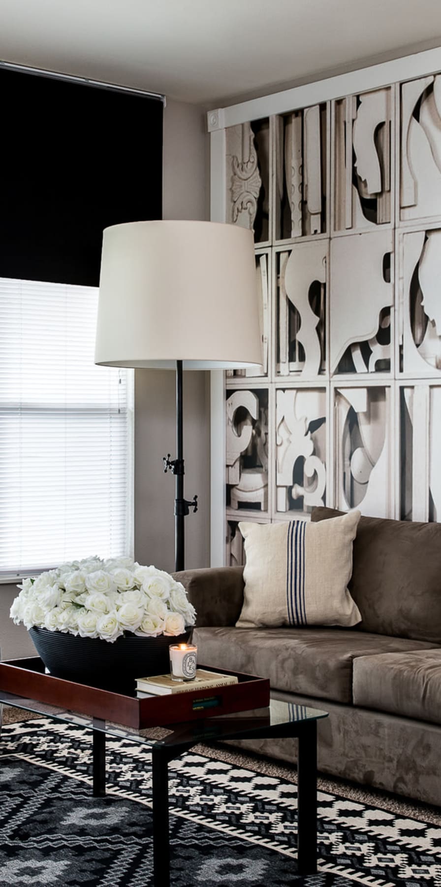 Model living room with modern artwork at Campus Quarters in Corpus Christi, Texas