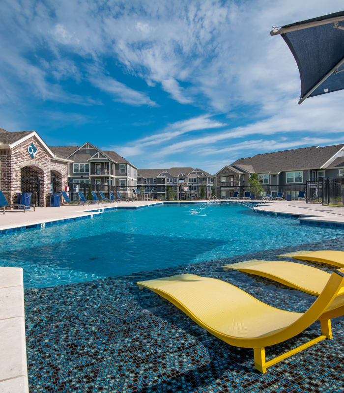 Sparkling pool and sundeck outside of Cottages at Crestview in Wichita, Kansas
