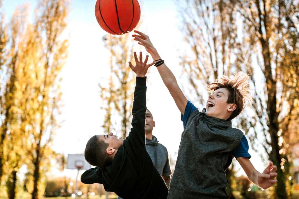 Kids playing basketball at Stone Lake in Indianapolis, Indiana