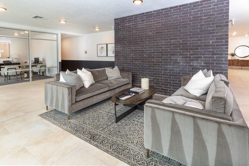 Community clubhouse lounge with couches at The Hardison in Salt Lake City, Utah