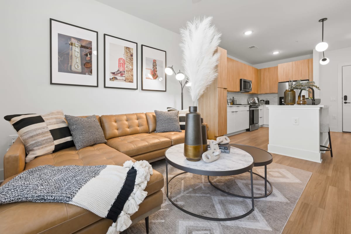 Living room and gourmet kitchen of a model apartment at The Scottie in Nashville, Tennessee