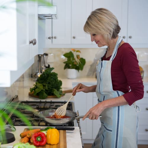 A resident cooking at Osprey Point in Virginia Beach, Virginia