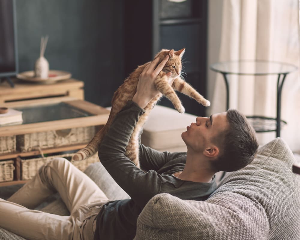 Resident with his cat at Olympus Highlands North in Albuquerque, New Mexico